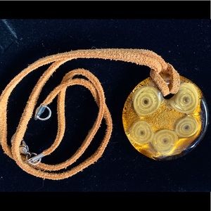 Unique glass pendant with 9” suede cord.